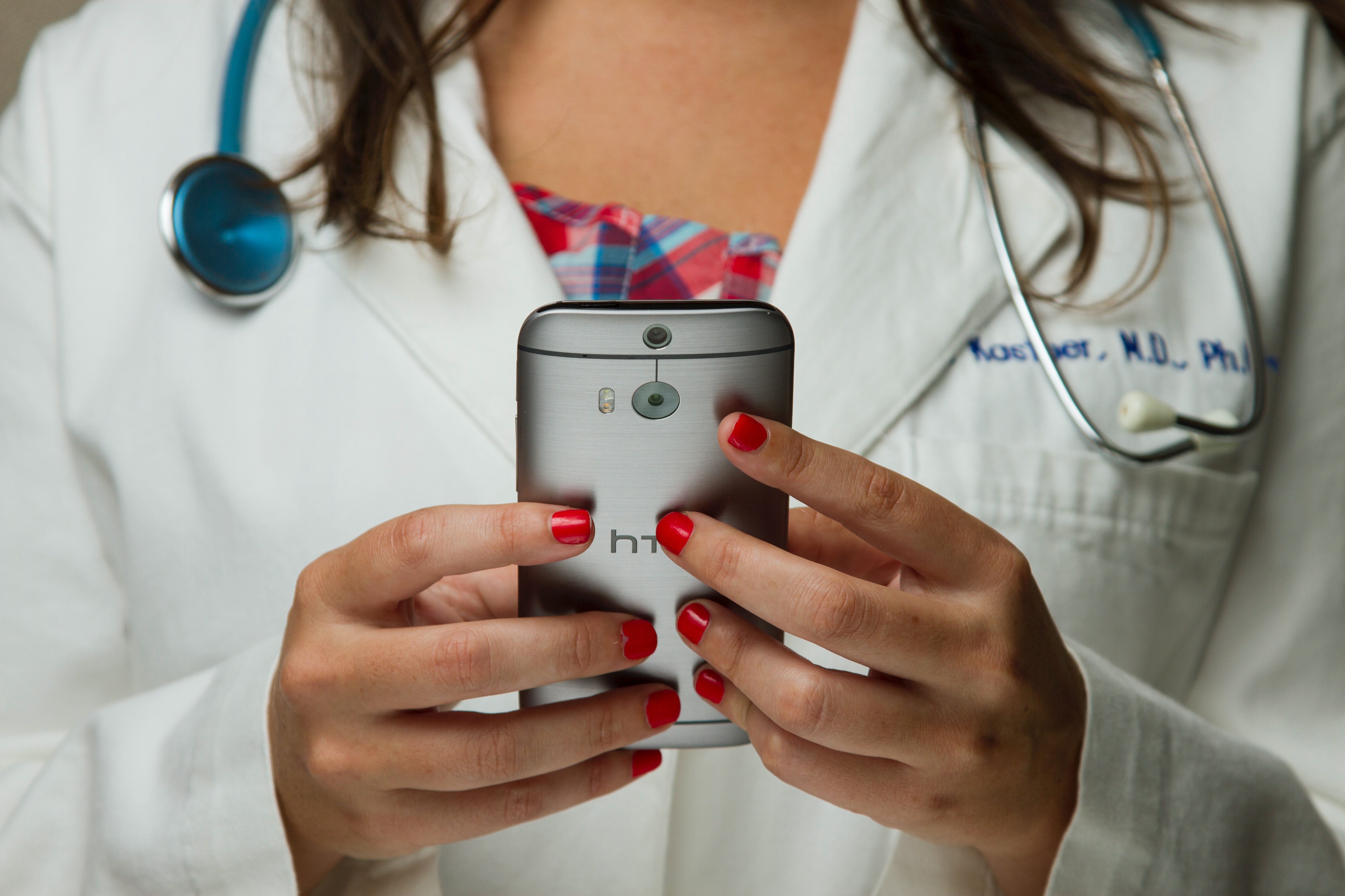 Female clinician using a smartphone